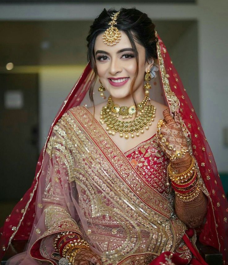 Bride receiving premium bridal makeup styling in Trichy